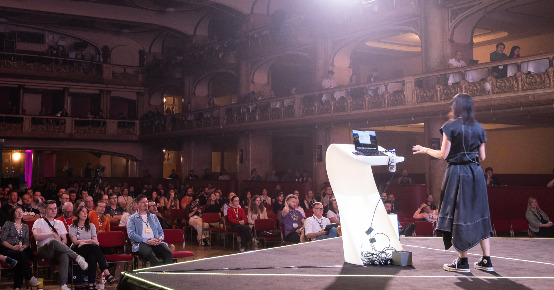 View from the back of the stage at WebExpo Prague with Geri speaking to the audience in the Lucerna Great Hall